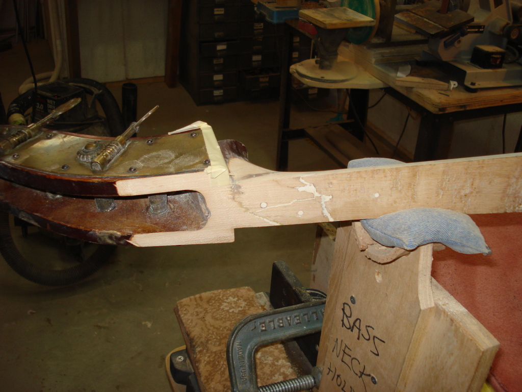 The neck repair appeared stable so we trued up the top portion